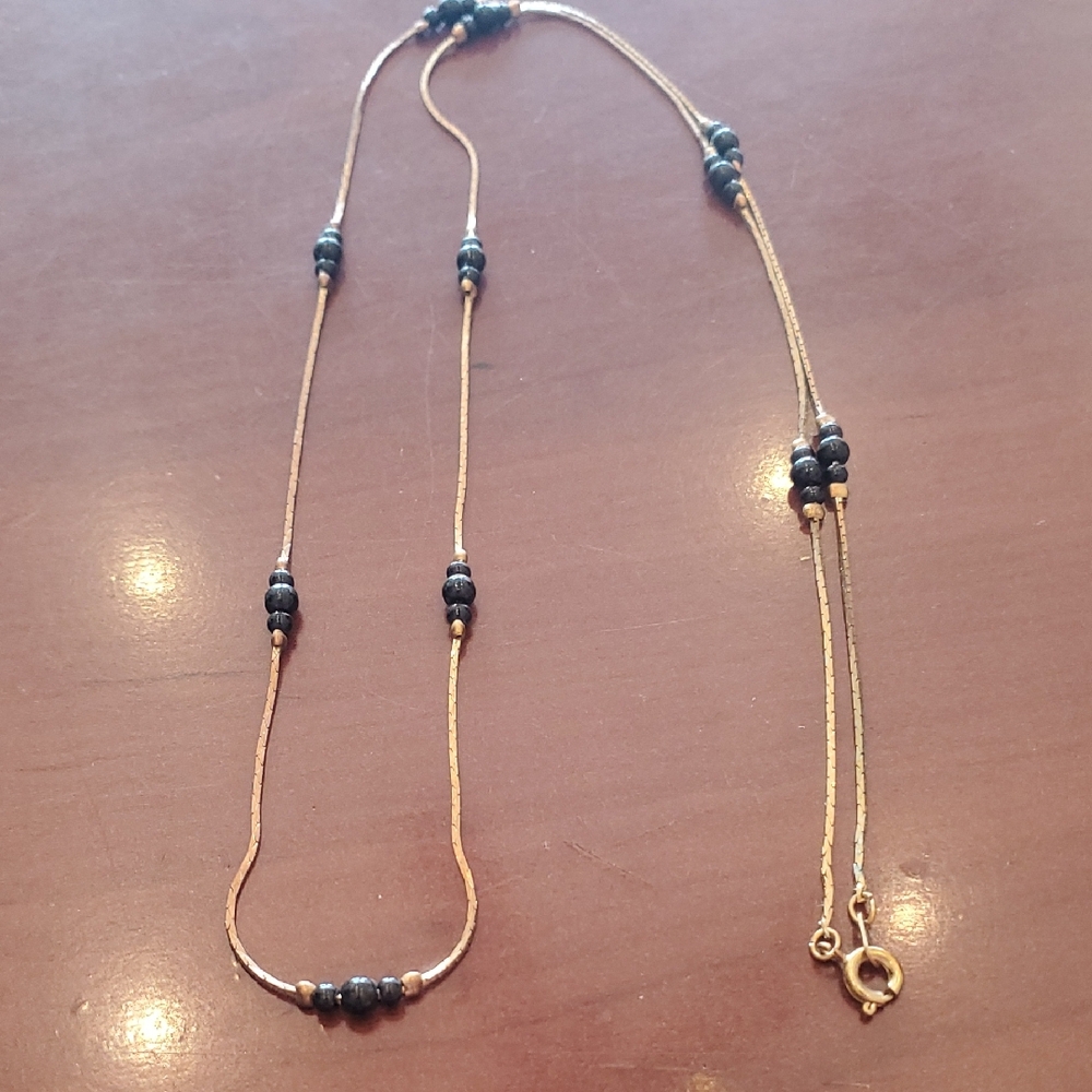 Elegant Gold and Black Beaded Necklace